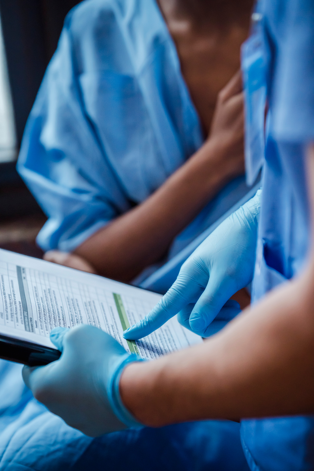 Nurse demonstrating diagnosis to patient